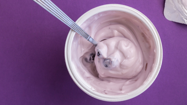 Berry yogurt in a cup with spoon