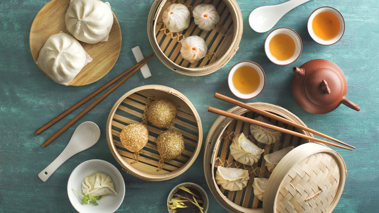 Dim sum spread with chopsticks on a table