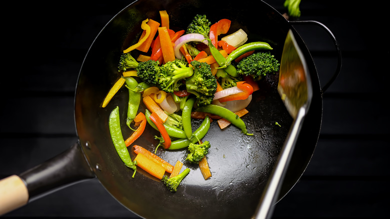 Top-down view of stir-fry vegetables in a wok