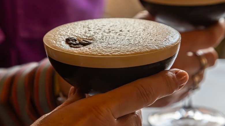 Hand holding an espresso martini