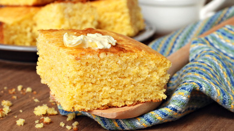 Slice of cornbread with butter on top 