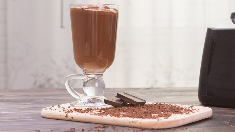 A frozen chocolate drink with chocolate pieces