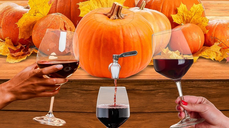 pouring wine out of a pumpkin