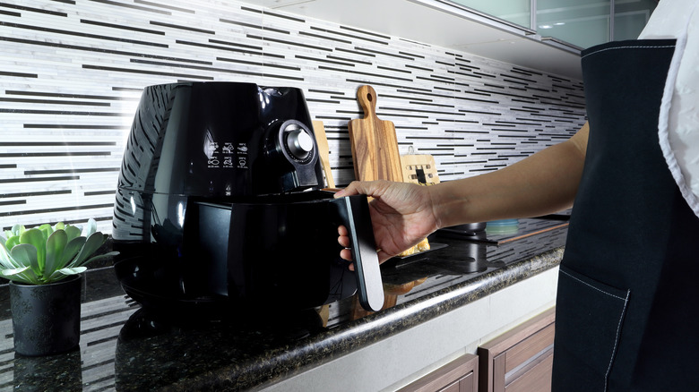 Black air fryer on a countertop