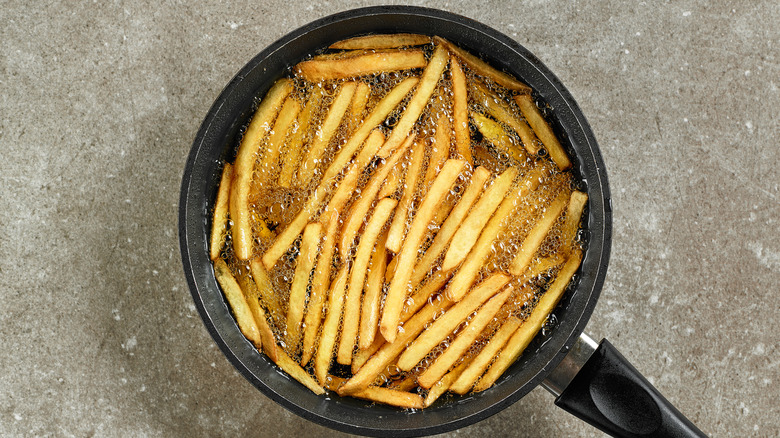 fries in an oily pan