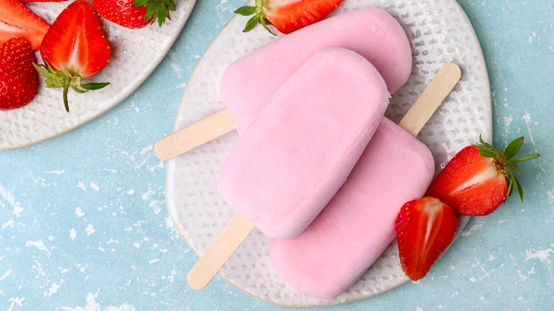 plate of strawberry yogurt popsicles