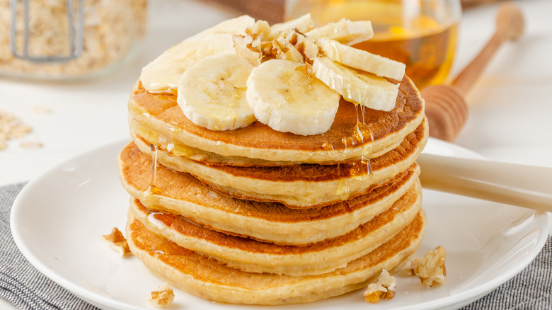 Stack of pancakes with bananas 