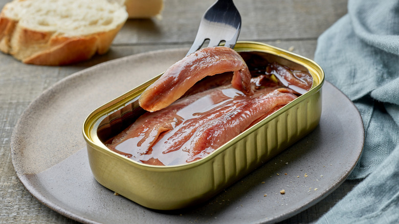 open tin of canned anchovy fillets