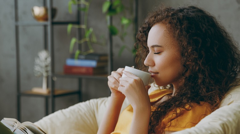 woman enjoying cup of coffee