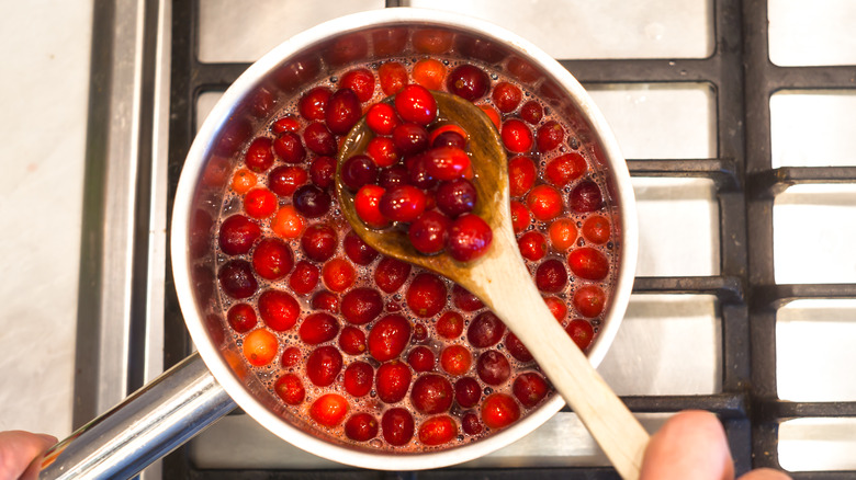 Making cranberry sauce in pot 