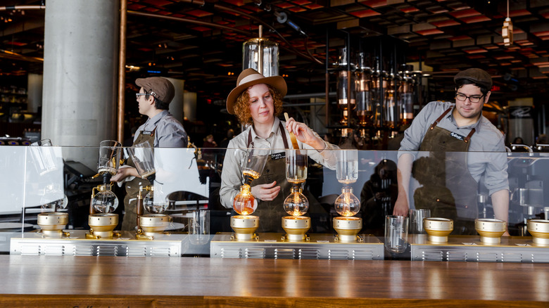 Starbucks baristas making specialty drinks 