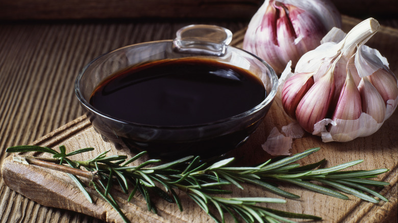 bowl of balsamic vinegar with garlic and rosemary