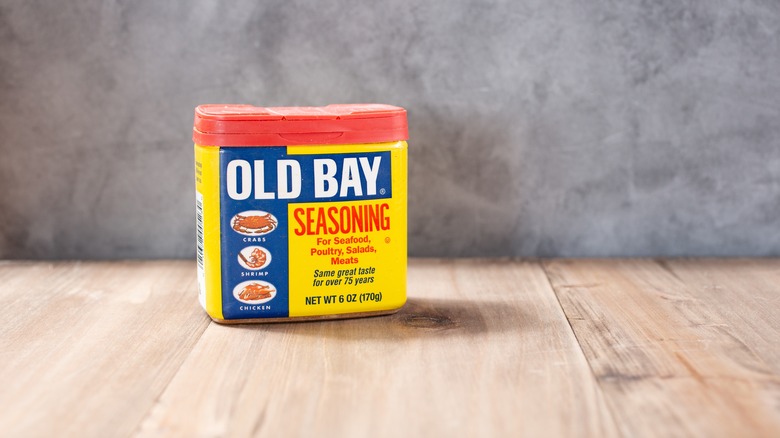 Old Bay seasoning on wooden board