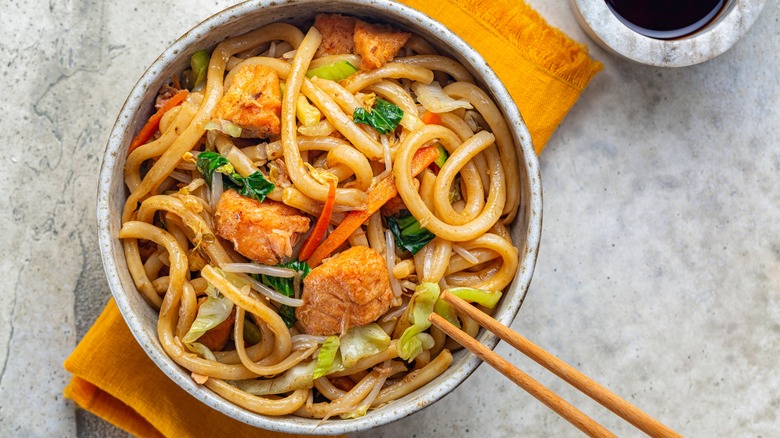 Stir-fried salmon udon noodles and greens