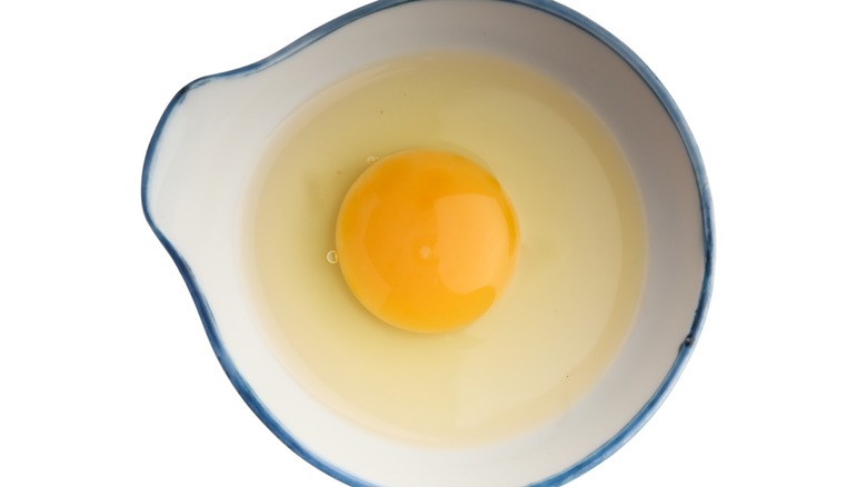 cracked egg in a bowl