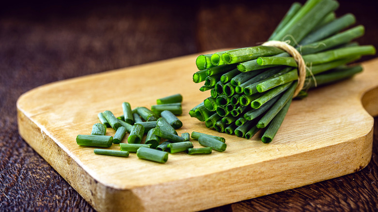 chopped chives on cutting board