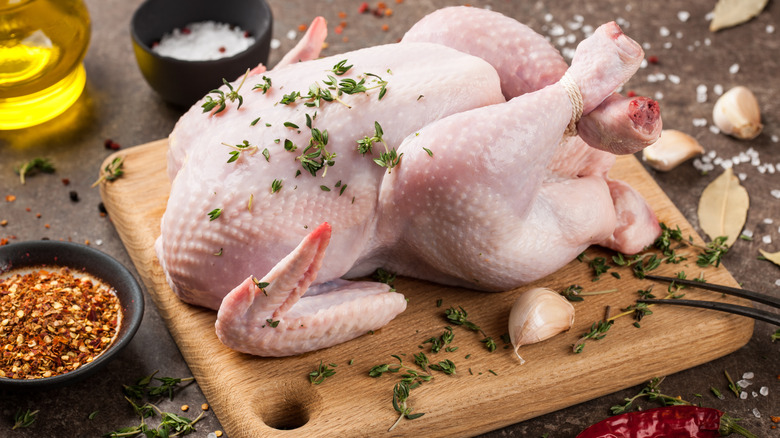 Raw chicken on cutting board