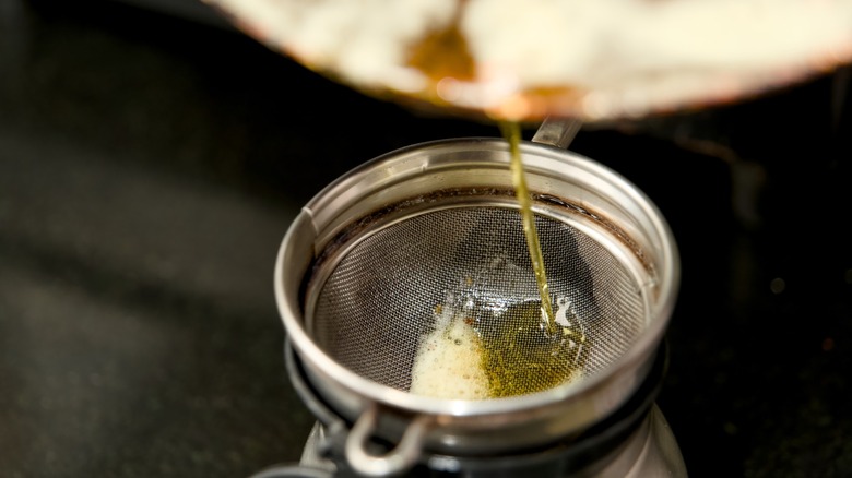 Butter being poured into strainer