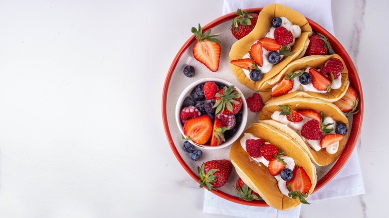 dessert tacos with berries and cream