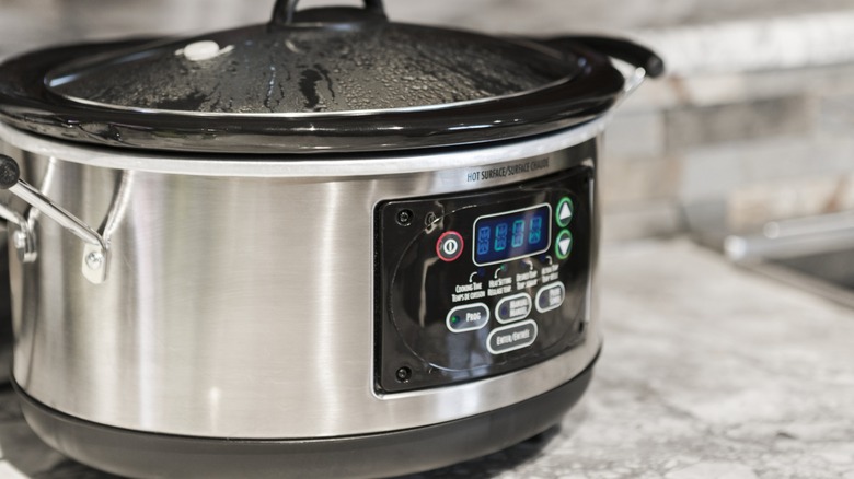 A slow cooker on a counter