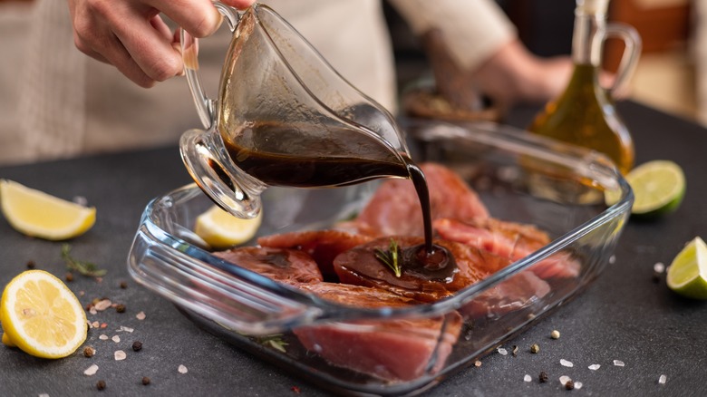 Soy marinade poured on pork chops