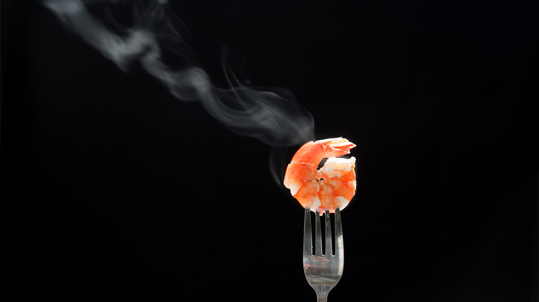 steaming shrimp on fork