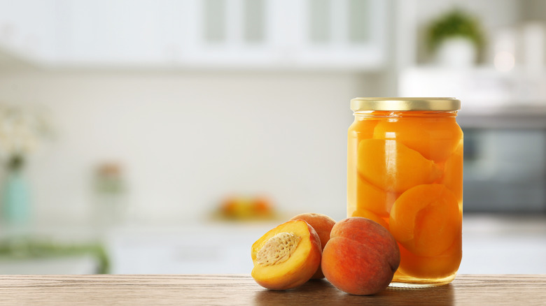 Jar of pickled peaches