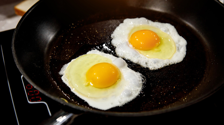 Fried eggs in pan