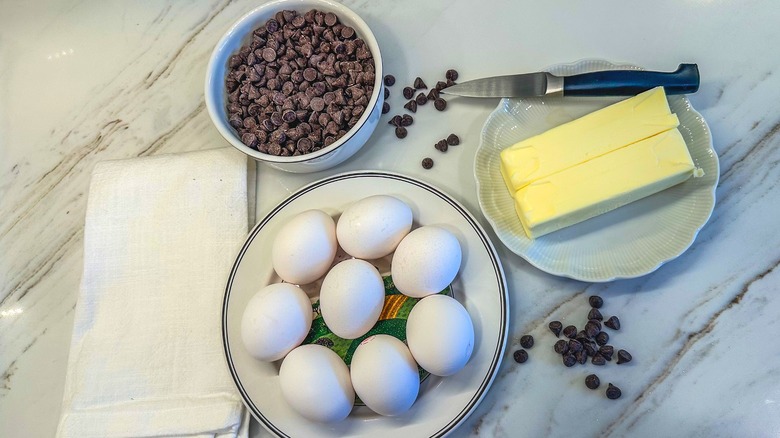 eggs, chocolate, and butter for a chocolate cake