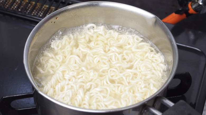 ramen noodles cooking in pot