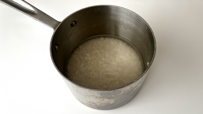 rice soaking in saucepan
