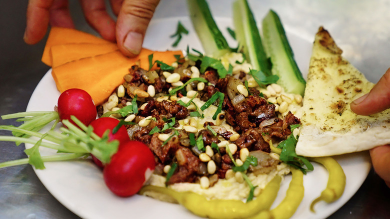 hummus with cricket mince vegetables and pita bread