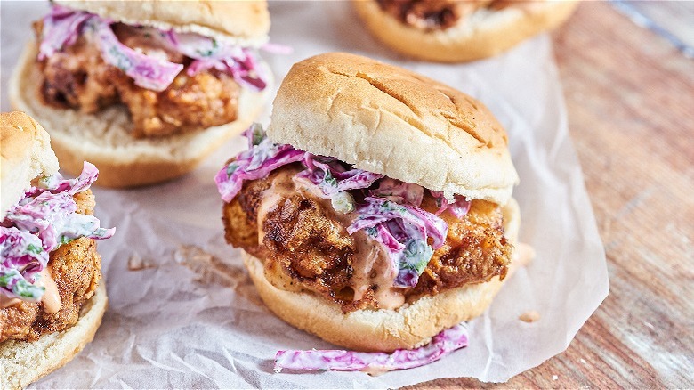 slider with sauce and slaw on table