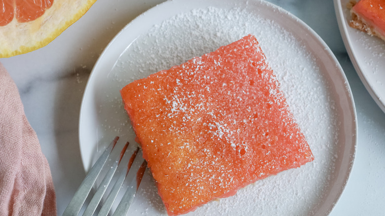 close up of a grapefruit bar on a plate