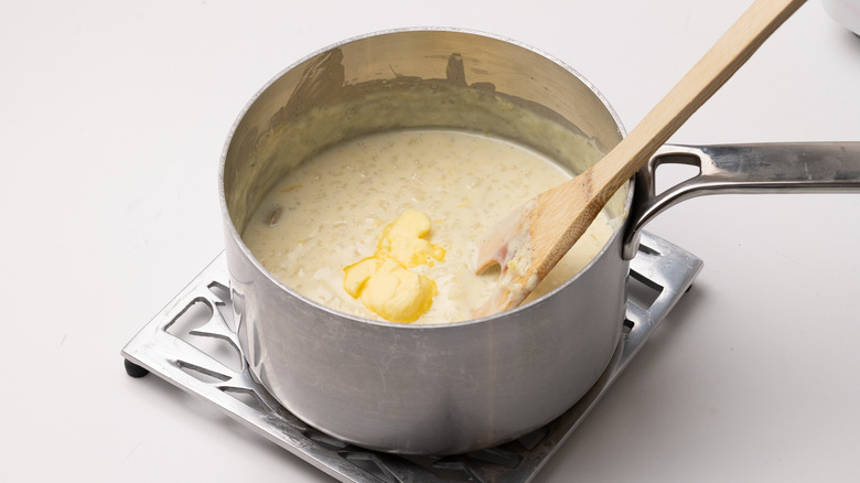 adding butter to rice pudding