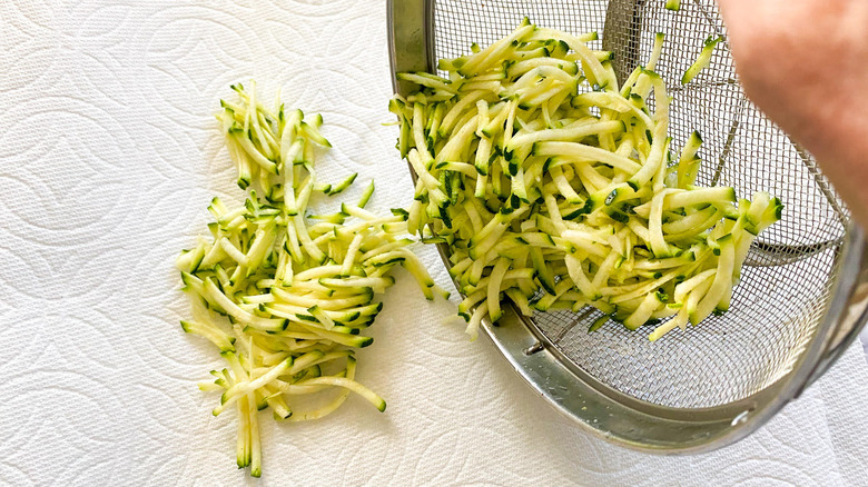 grated zucchini on towel 