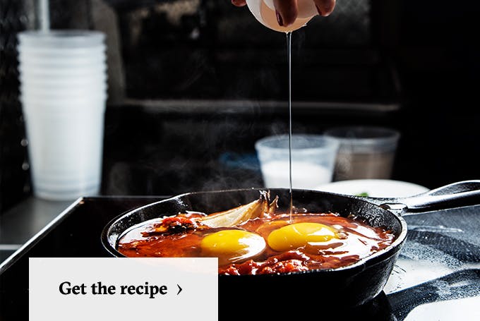 https://www.tastingtable.com/tastingtable/articles/2017_04/Inline1-budget-shakshuak-roasted-tomato-sauce-poached-eggs.jpg?auto=format%2Ccompress&ixjsv=2.2.3